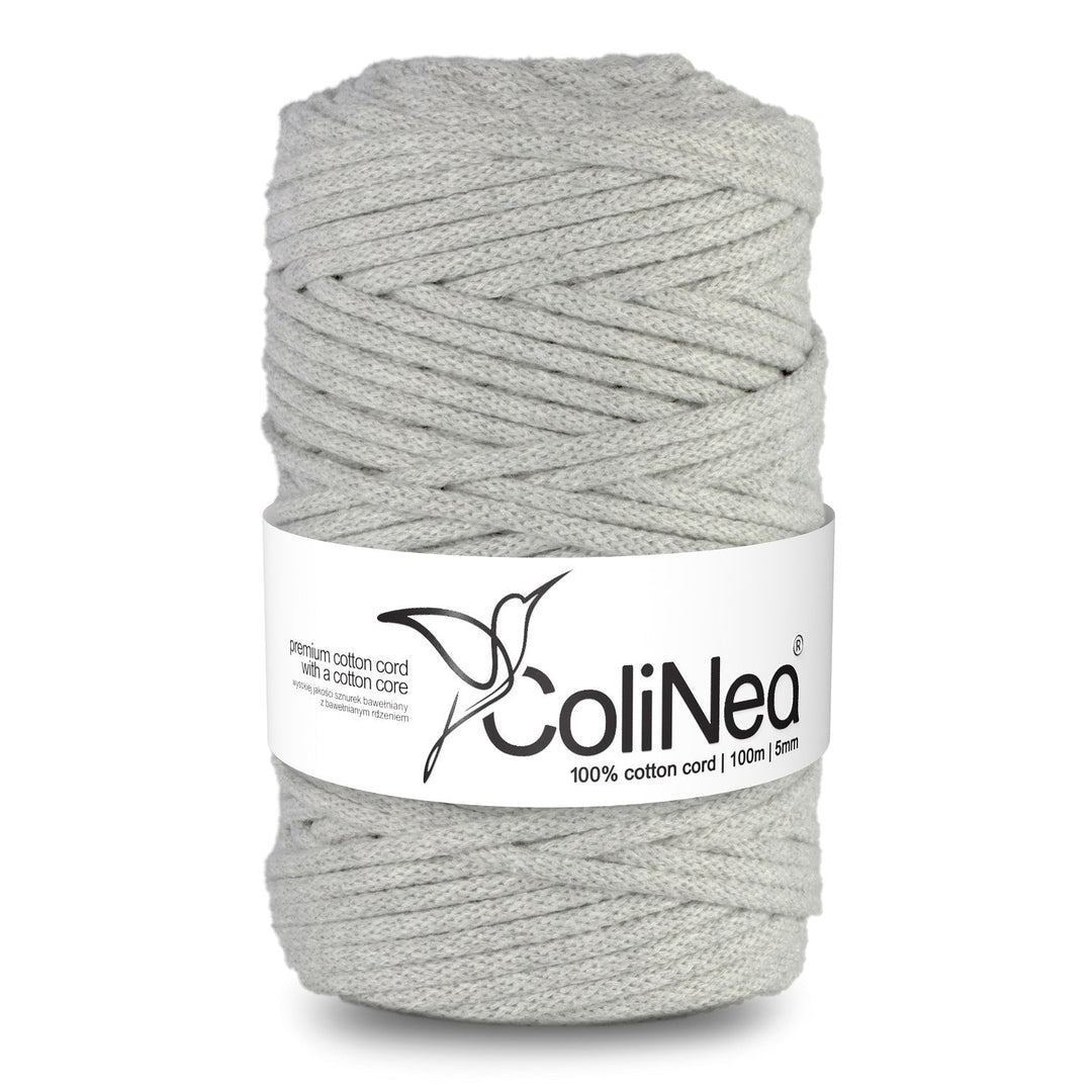 ColiNea's braided cotton cord with a cotton core. This 5mm cord, spanning 100m, comes in a sophisticated light gray, offering both durability and style.