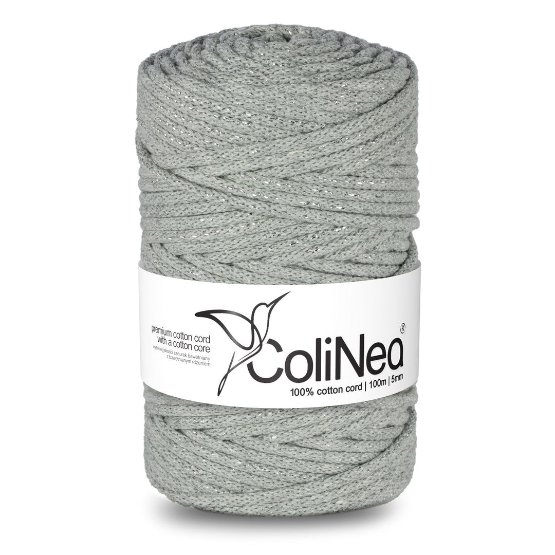 ColiNea's braided cotton cord with a cotton core, delicately woven with silver threads. This 5mm cord spans 100m, adding a touch of elegance to its grey hue.