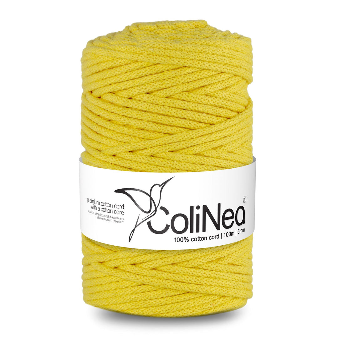 ColiNea's braided cotton cord with a cotton core. This 5mm cord spans 100m and features a delightful light yellow hue, offering both durability and charm.